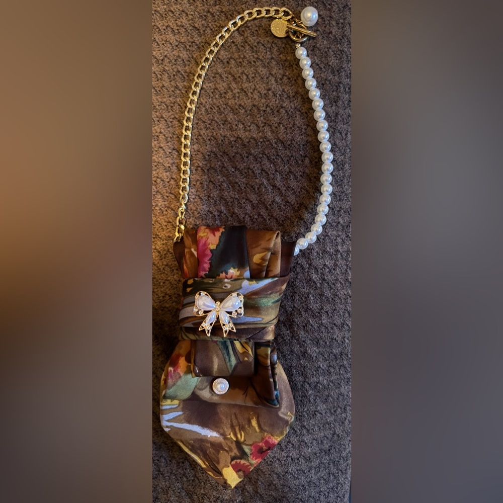 Woman’s Tie-Floral Bow Clutch with Pearl and Gold Chain